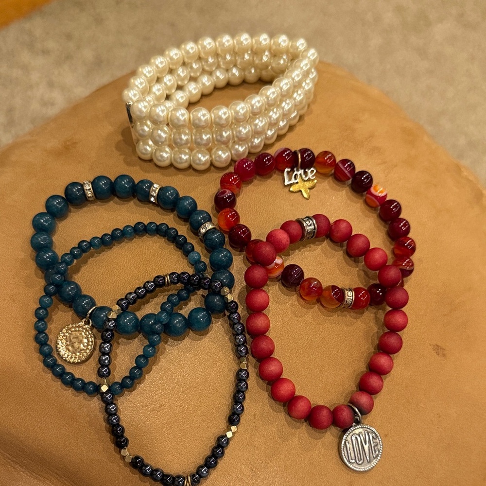Assorted bracelets, red, teal, and white